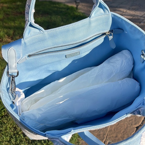 This Prada embroidered drill tote features an enlarged Prada logo on the front. - Picture 8 of 11